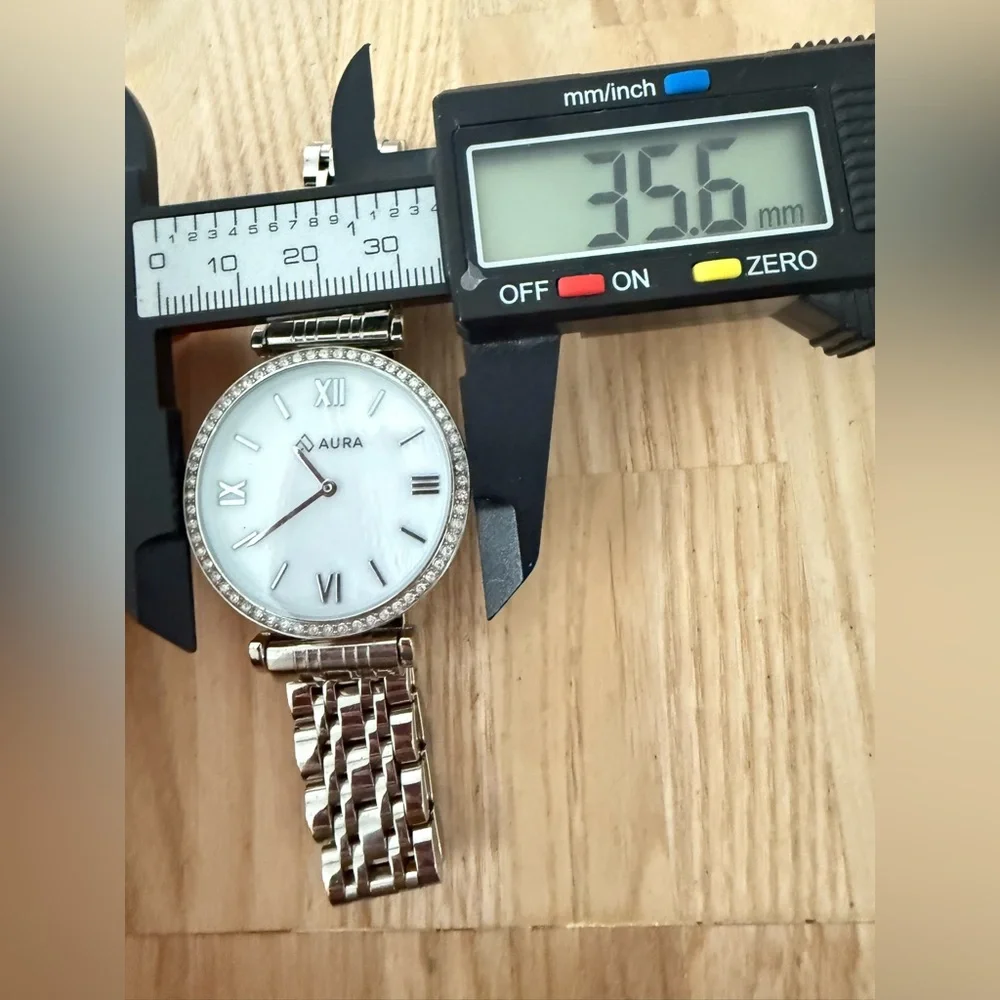 Aura ladies silver tone mother of pearl watch NEW BATTERY